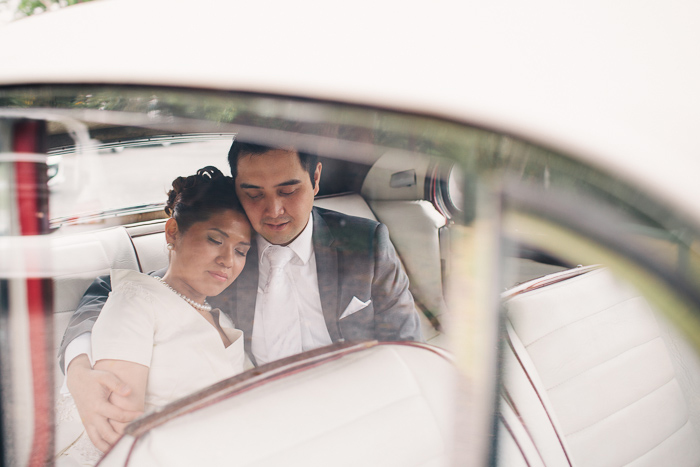 husband-and-wife-in-wedding-car-getaway