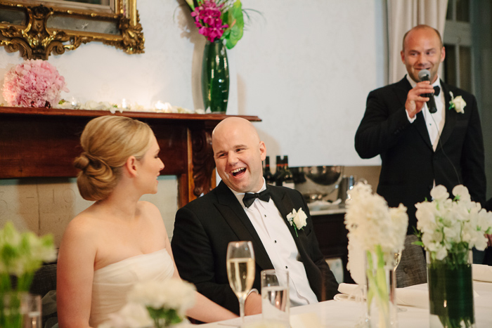 excited-groom-laughs-with-wife