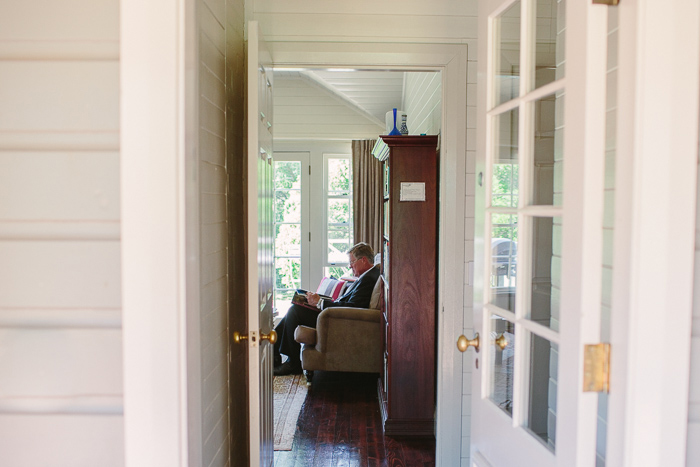 father of the bride reading in cottage