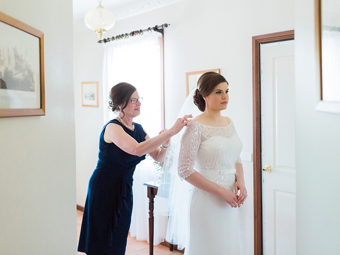 mother of the bride adjusting wedding dress in bowral