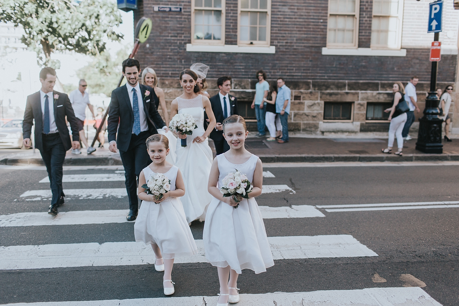 crossing the road at argyle st in the rocks with bridal party