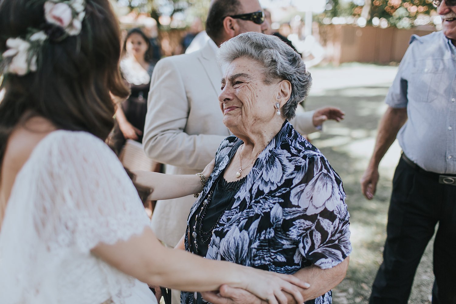 bride being congratulated by nonna after the ceremony