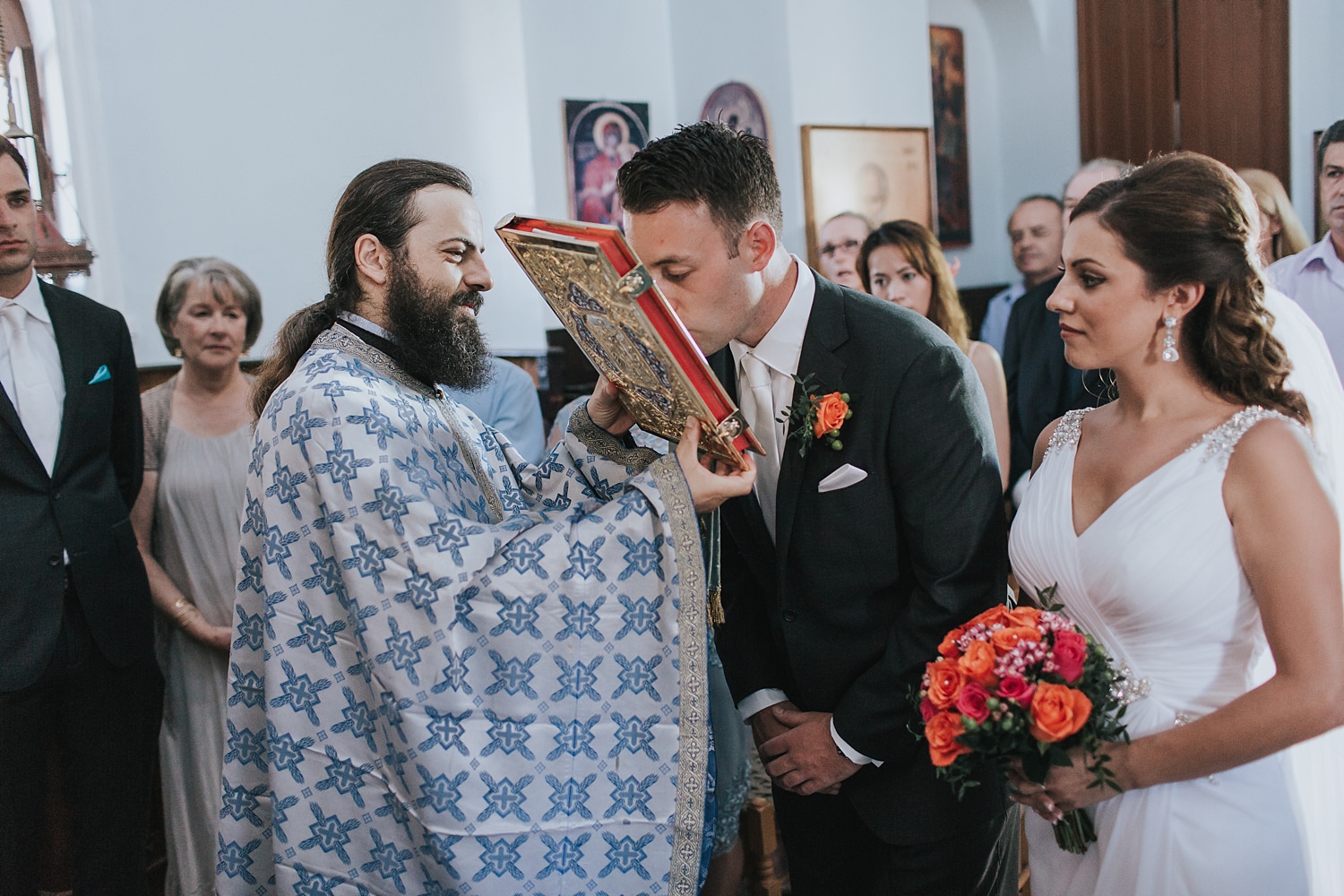 kissing the gospel in greek orthodox wedding