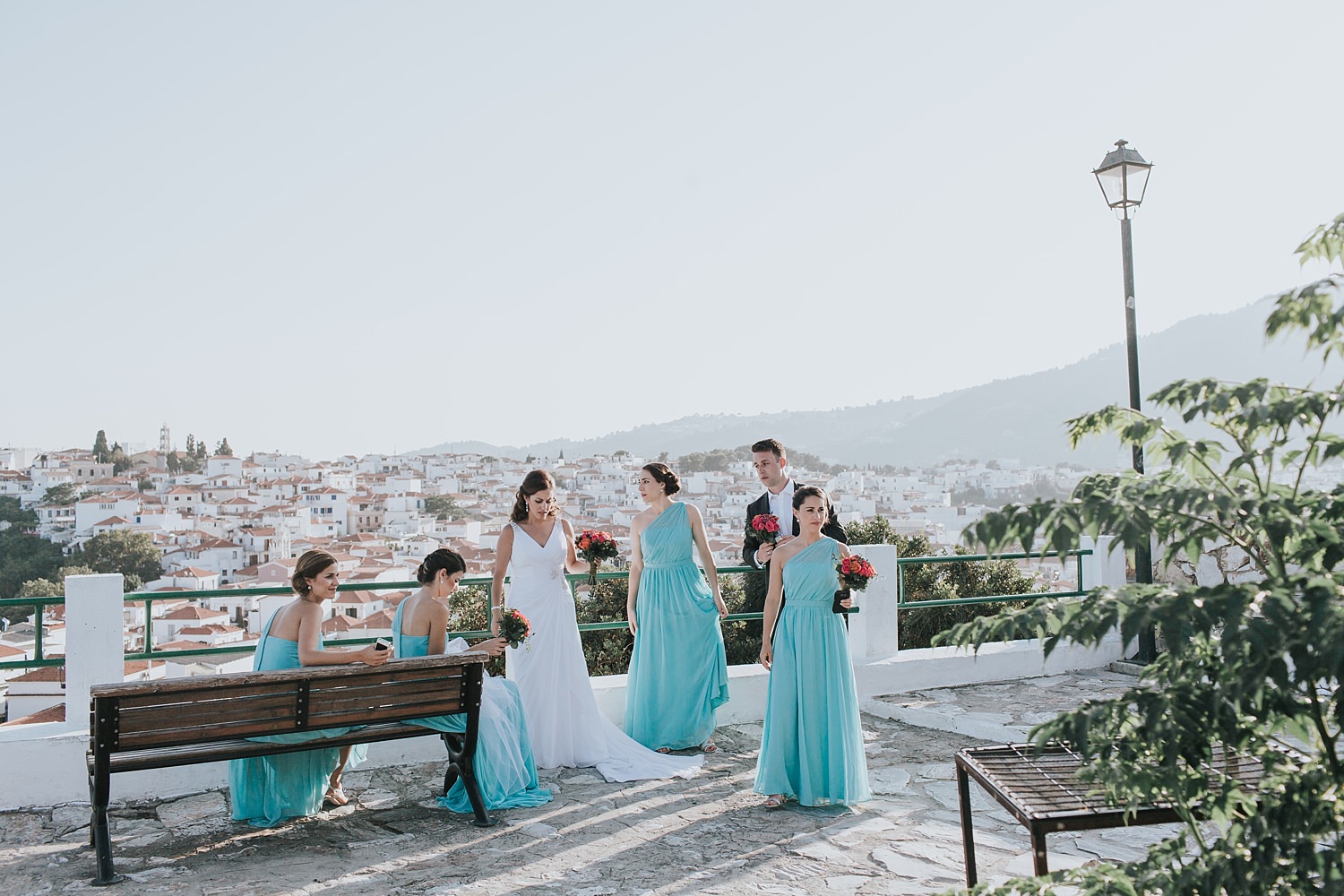 bridal party enjoy the view of skiathos