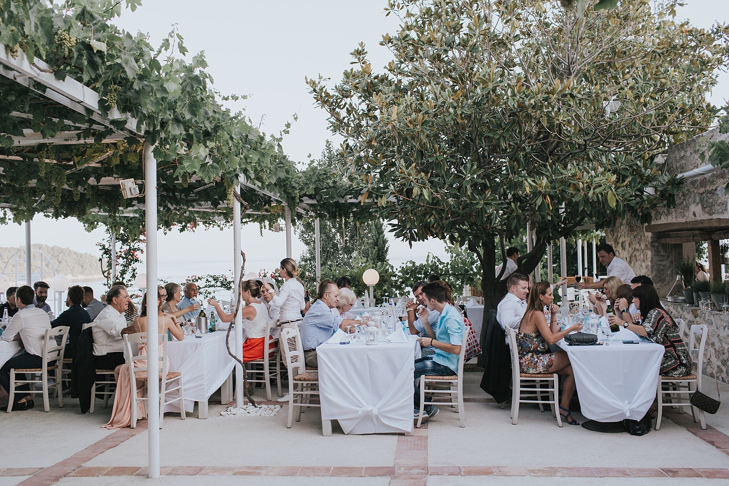guests seated in skiathos for wedding reception