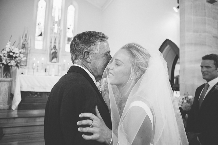 bride embraces her father at St Francis Xavier Church