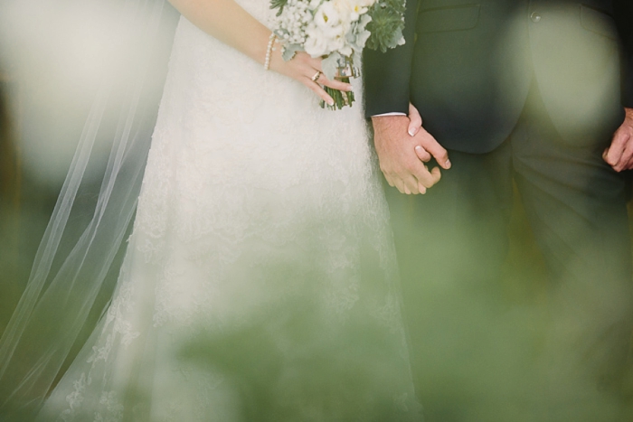 bride-and-groom-holding-hands