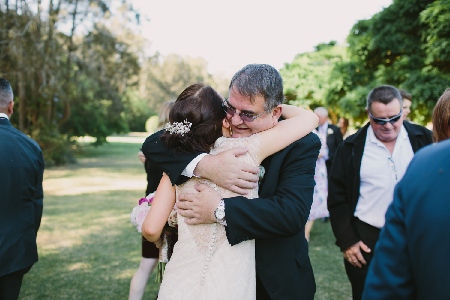 Father of the Groom hugs his new daughter at Hunter Valley wedding