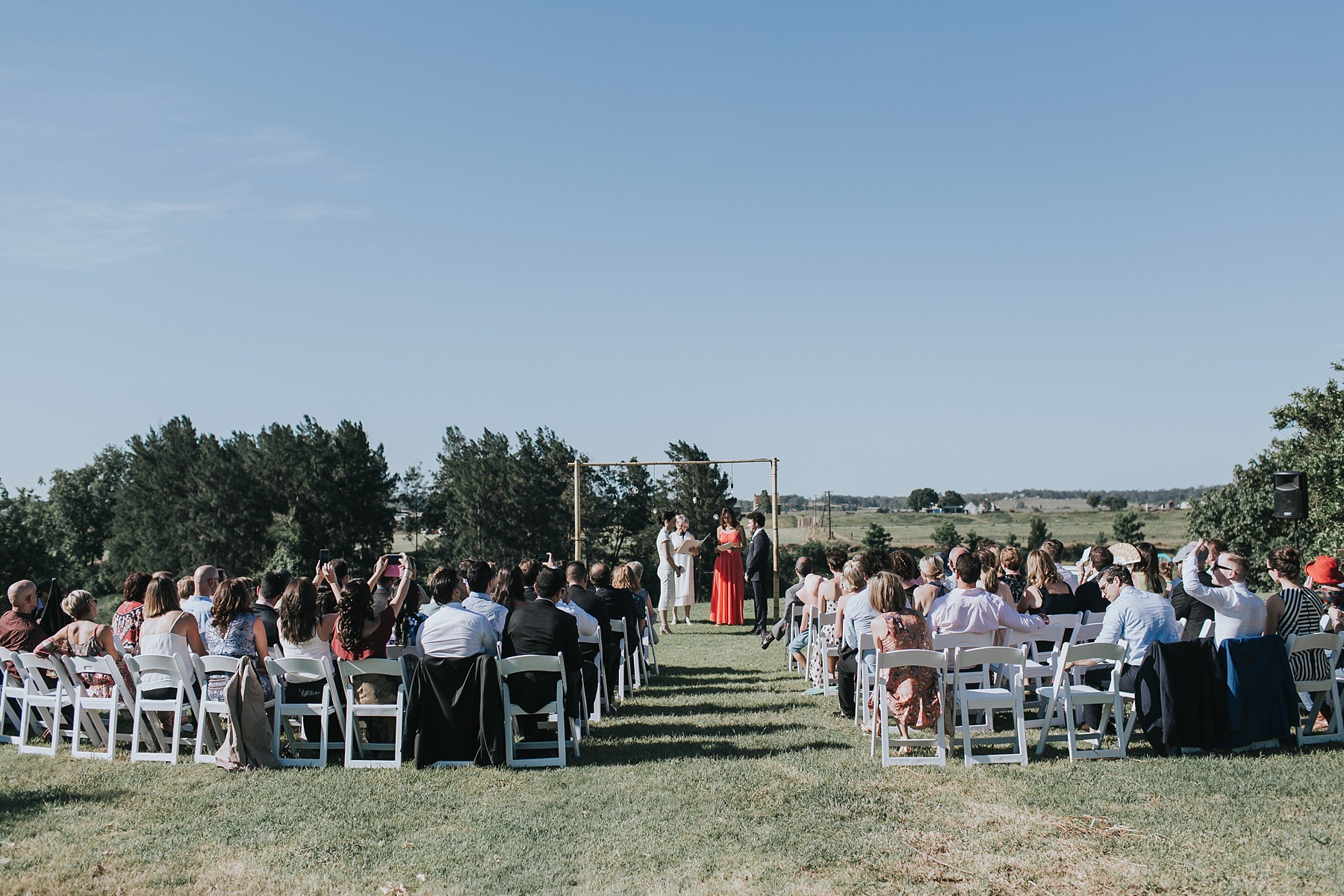 outdoor wedding ceremony in the sun at cornwallis house