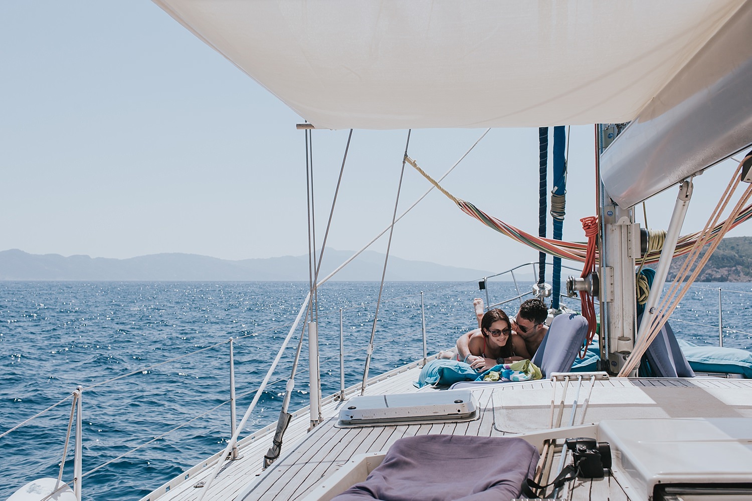 bride and groom intimate on a sailing tour of skiathos