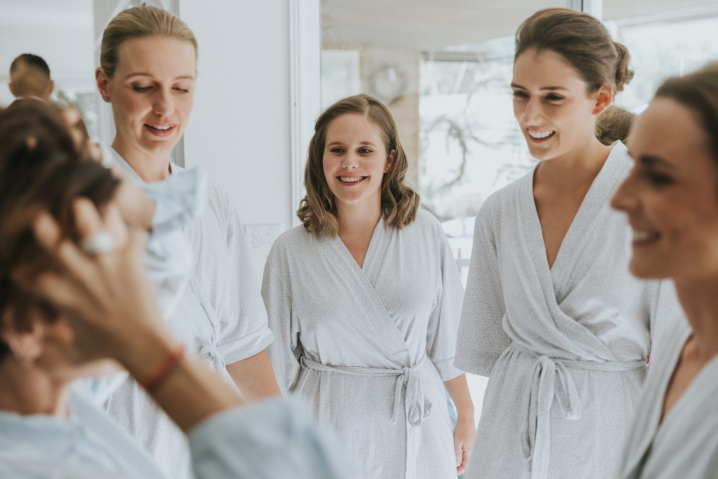 bridesmaids getting ready on wedding morning in berry