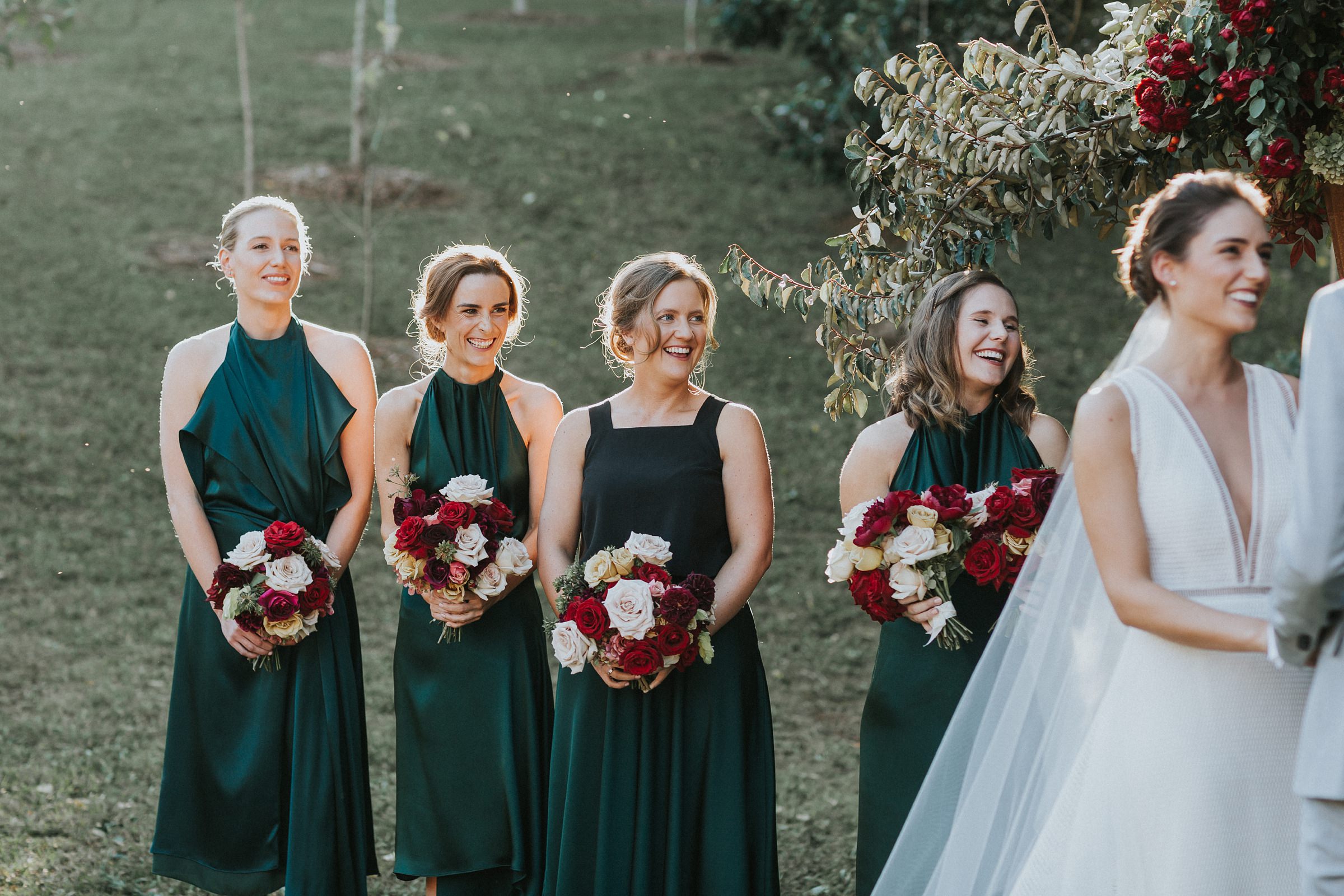 bridesmaids smiling and excited for wedding ceremony