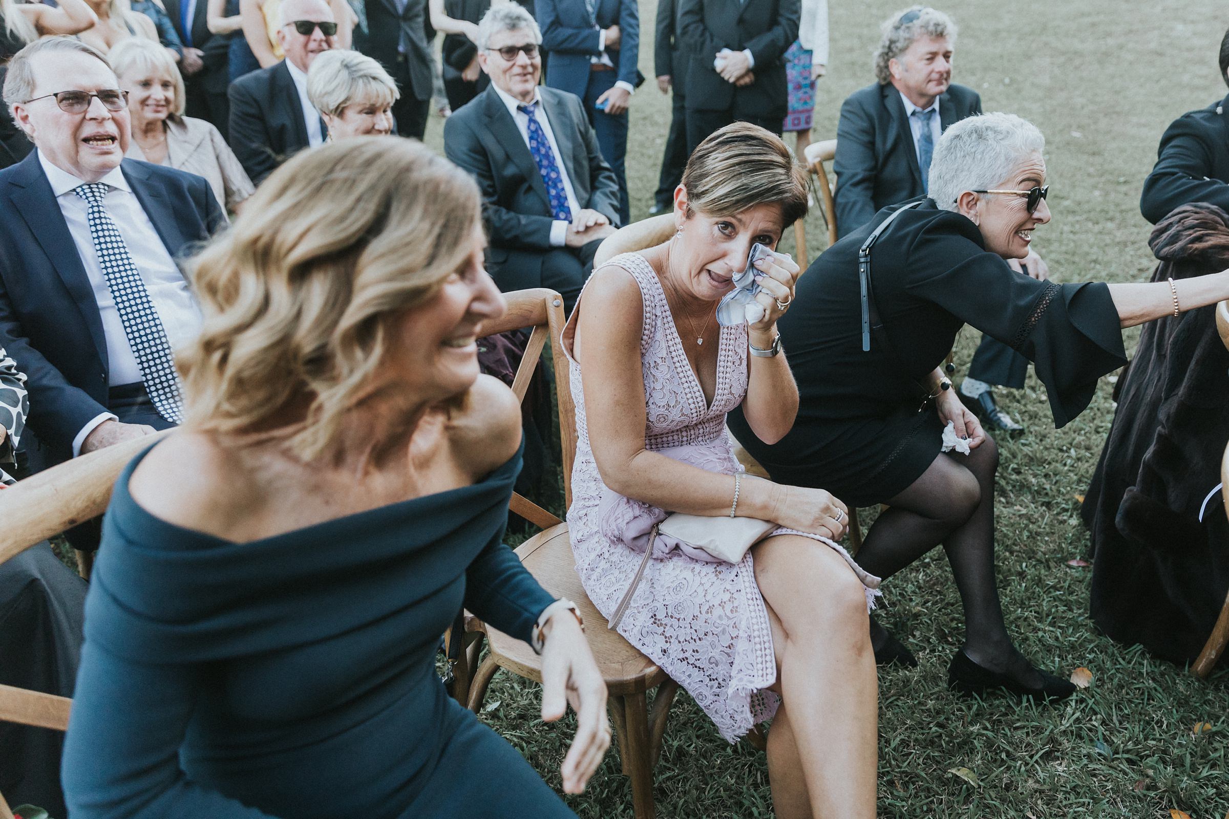 guests weeping tears of joy during wedding ceremony