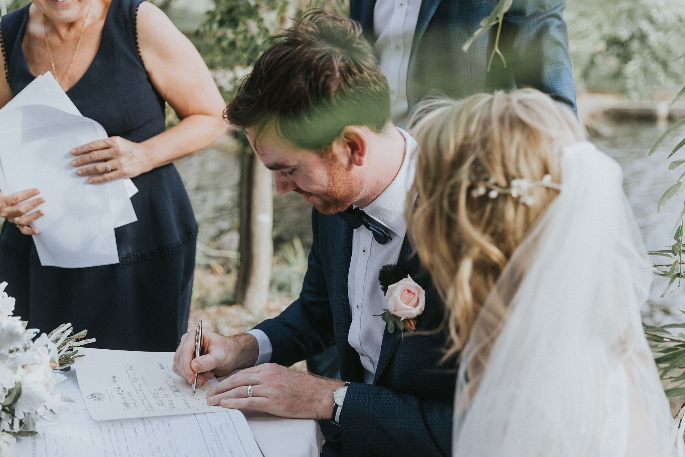 groom signs his life away at kangaroo valley wedding