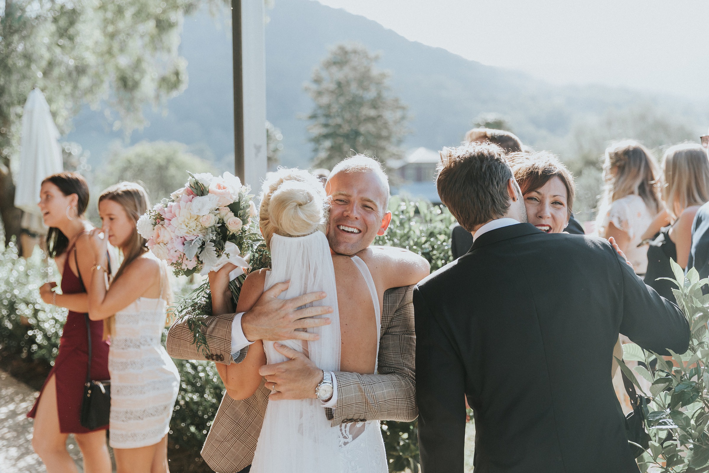 candid photos of guests congratulating the bride and groom