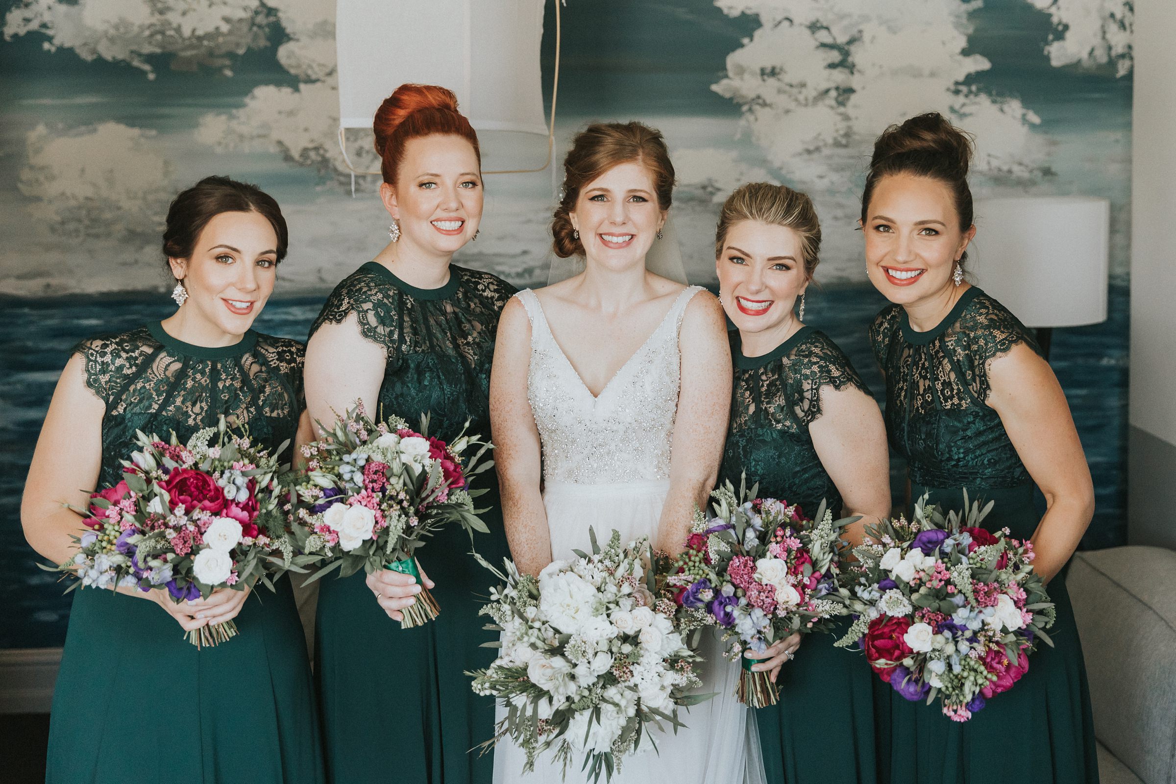 bride with her bridesmaids on the wedding morning